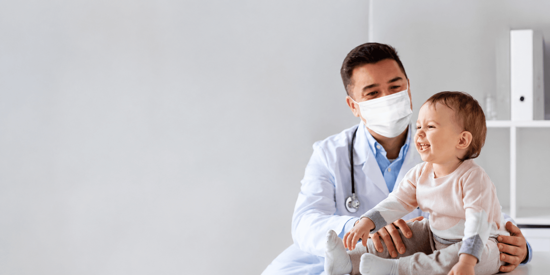 Dr. Gaurav Deore caring for a young patient, Pediatrician Nashik